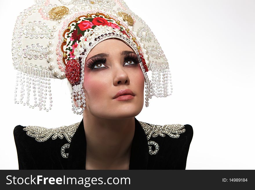 Attractive model in exclusive design clothes on manners old-slavic. Photo.