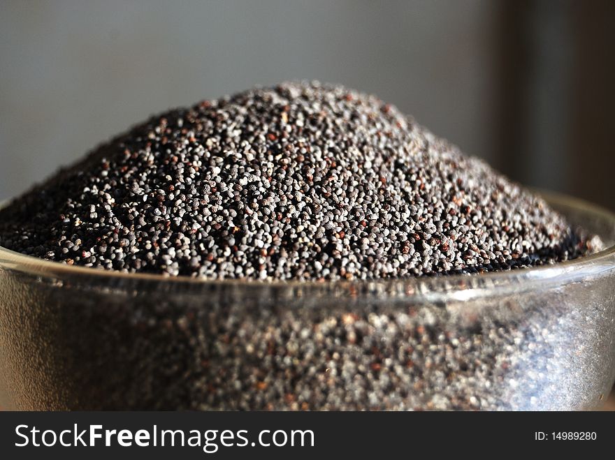 Poppy seeds in a glass tea-bowl