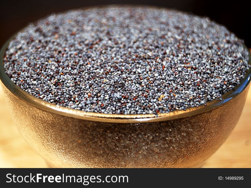 Poppy seeds in a glass tea-bowl