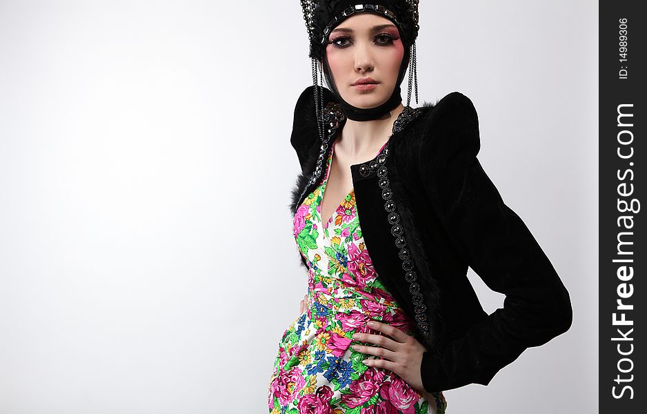 Attractive model in exclusive design clothes on manners old-slavic. Photo.