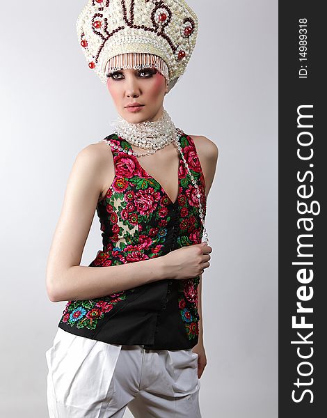Attractive model in exclusive design clothes on manners old-slavic. Photo.