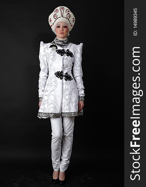 Attractive model in exclusive design clothes on manners old-slavic. Photo.