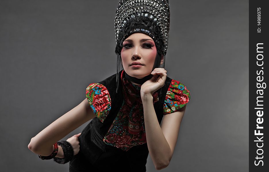 Attractive model in exclusive design clothes on manners old-slavic. Photo.