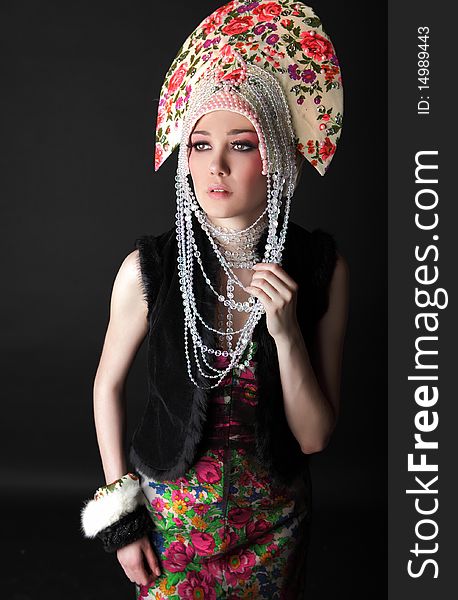 Attractive model in exclusive design clothes on manners old-slavic. Photo.