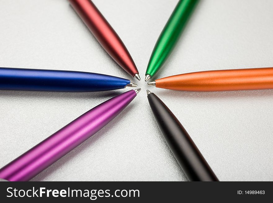 Set of colored pens on table