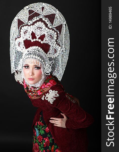 Attractive model in exclusive design clothes on manners old-slavic. Photo.