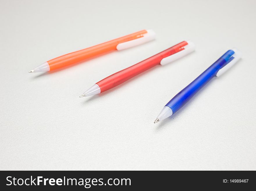 Set of colored pens on grey table. Set of colored pens on grey table