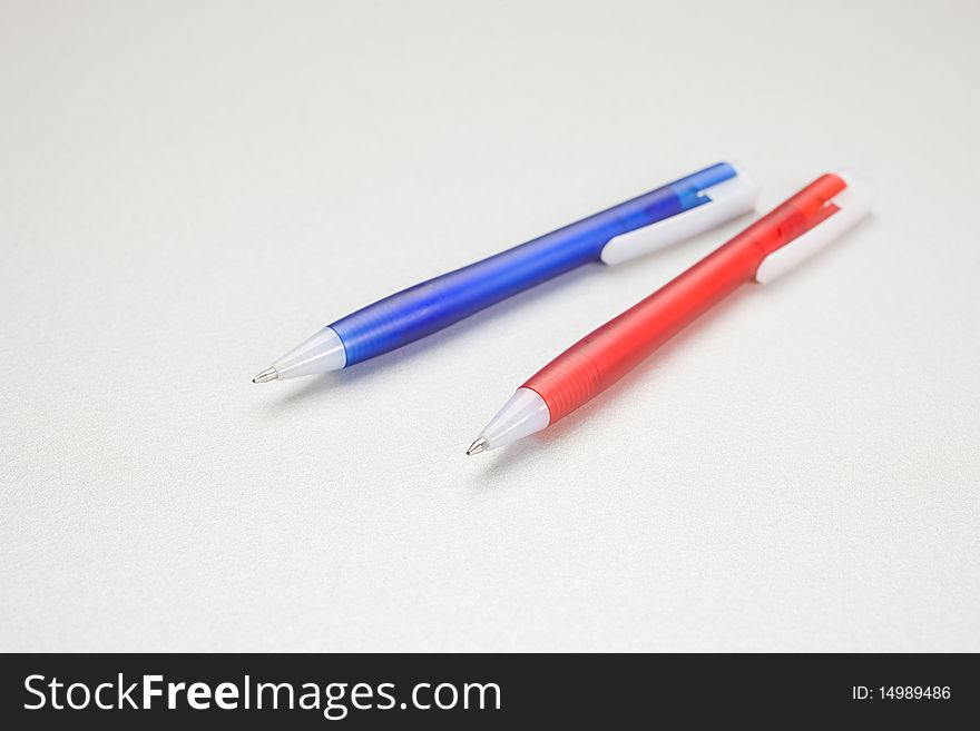 Set of colored pens on grey table. Set of colored pens on grey table