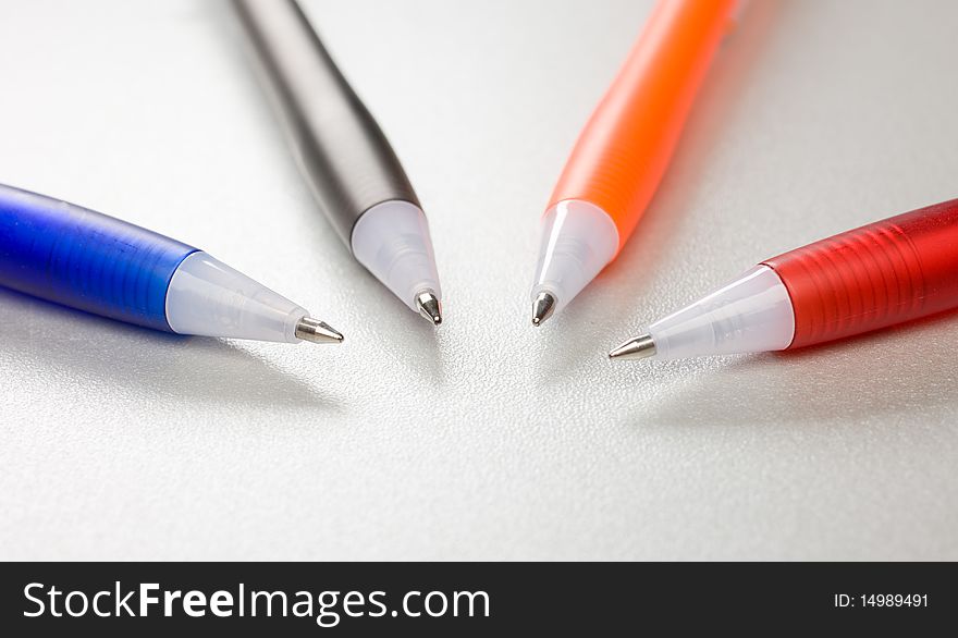 Set of colored pens on grey table. Set of colored pens on grey table