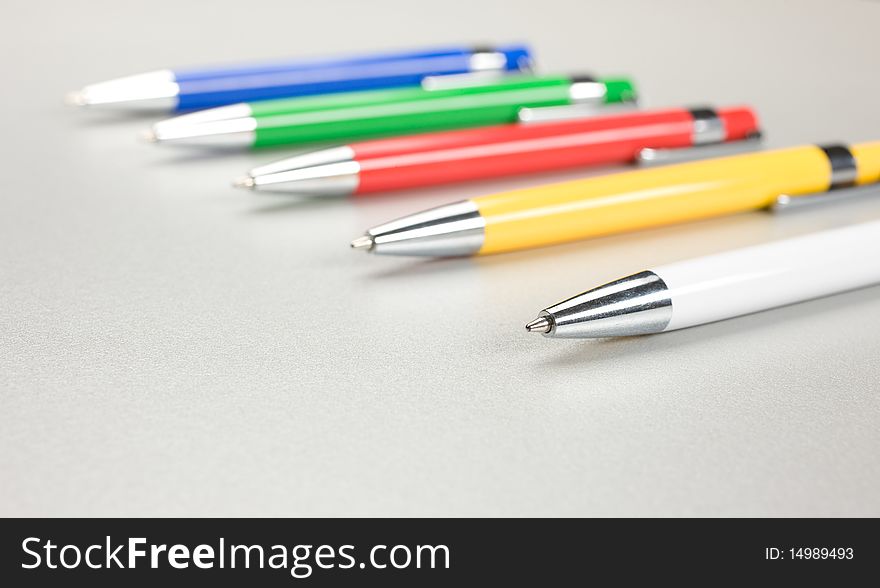 Set of colored pens on table