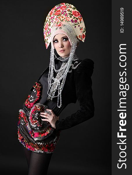 Attractive model in exclusive design clothes on manners old-slavic. Photo.