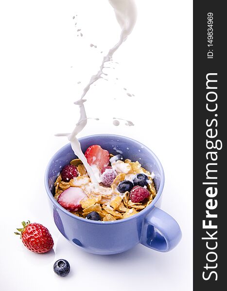 In the cup for breakfast cereals, berries and fresh milk. In the cup for breakfast cereals, berries and fresh milk