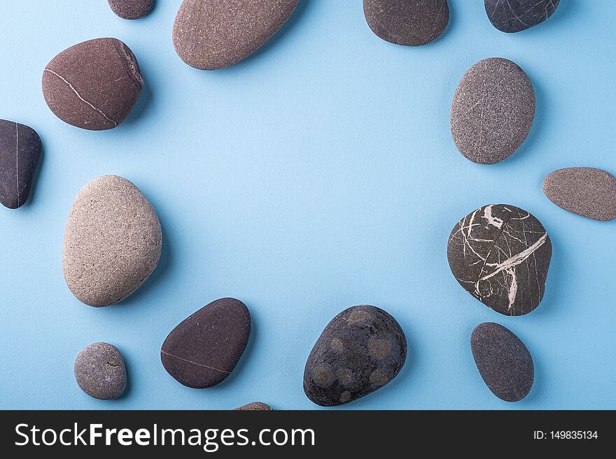 Copy Space Circle Of Pebbles Summer Background Top View On Blue Background