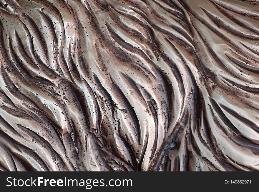 Details and decorative bas-relief ornament from metal of forged stamping iron gate as background texture