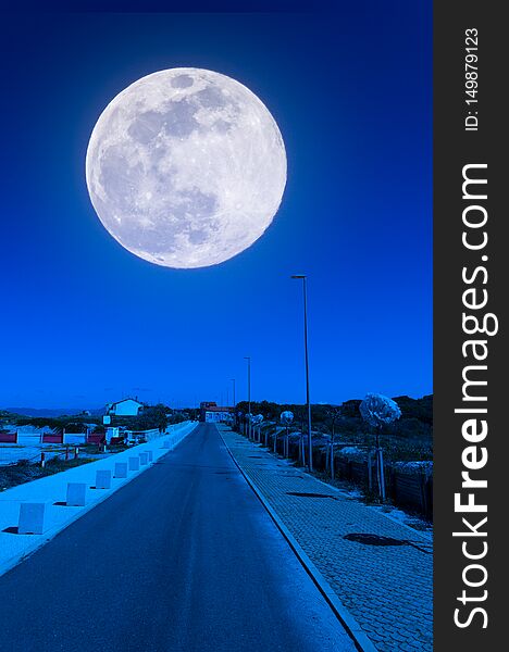 Desert road near the beach at night with super moon, blue, sky, landscape, sea, nature, full, light, background, moonlight, dark, water, lunar, ocean, black, wave, beautiful, space, romantic, scene, tranquil, horizon, calm, astronomy, supermoon