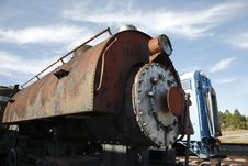 Closeup Photo Of An Old Steam Locomotive Engine With A Train Car In The Background Stock Photos Closeup Photo Of An Old Steam Locomotive Engine With A Train Car In The Background Stock Photos