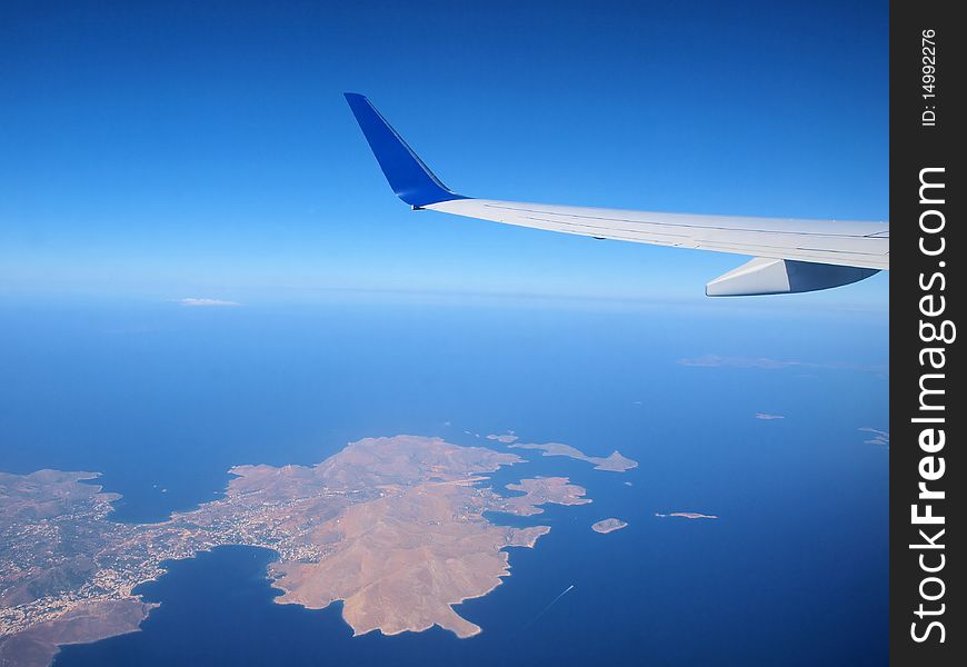 Airplane flying above greek islands. Airplane flying above greek islands