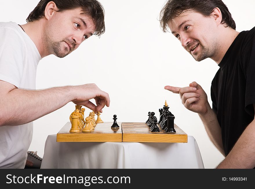 Chess players. Two men play a chess