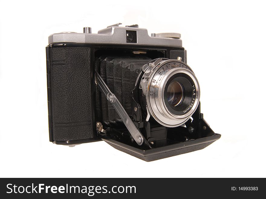 Old photo camera isolated on white background