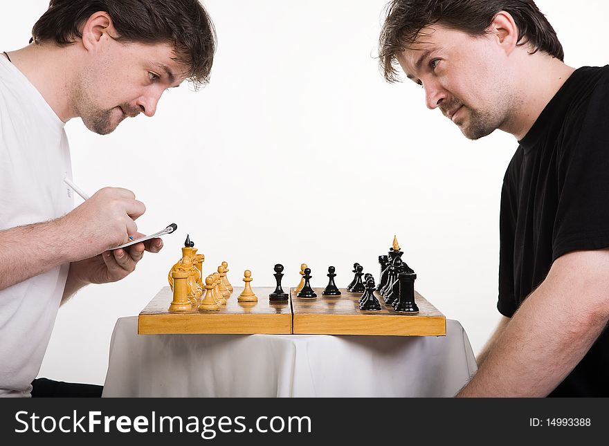 Chess players. Two men play a chess