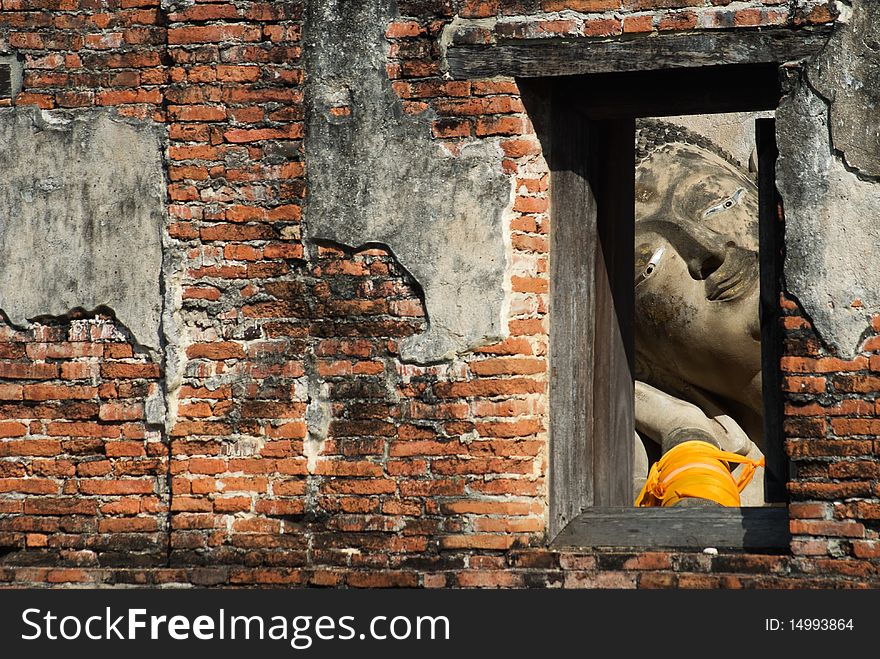 Reclining buddha in window frame,Ayuttha,Thailand