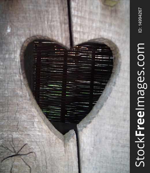 A heart cut out from an old wooden toilet door. A heart cut out from an old wooden toilet door