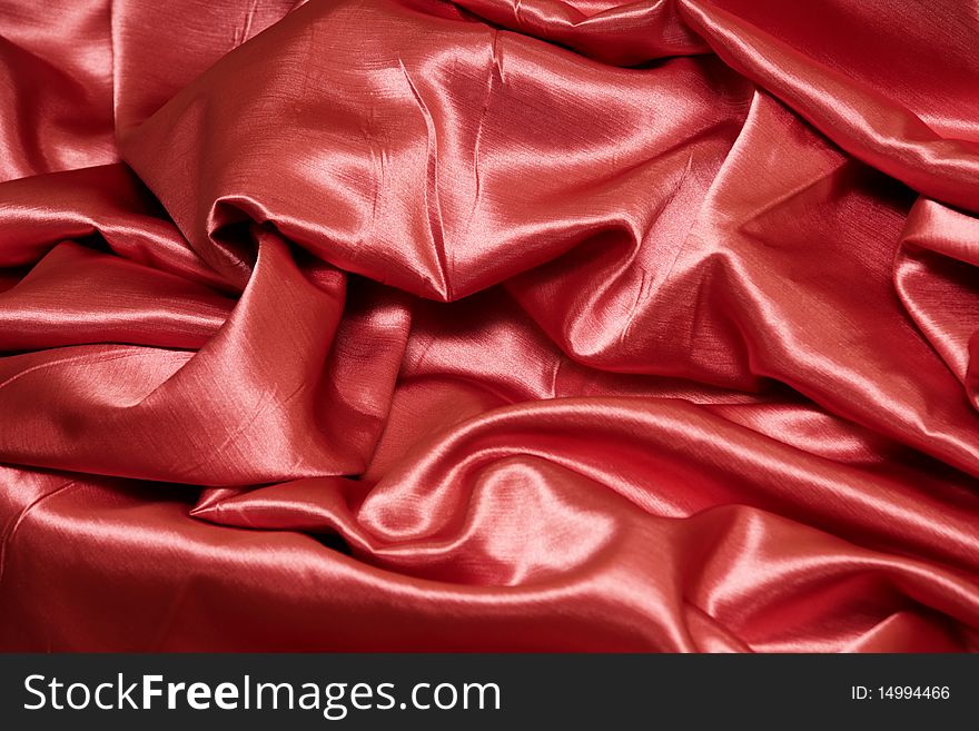 A red satin background or texture