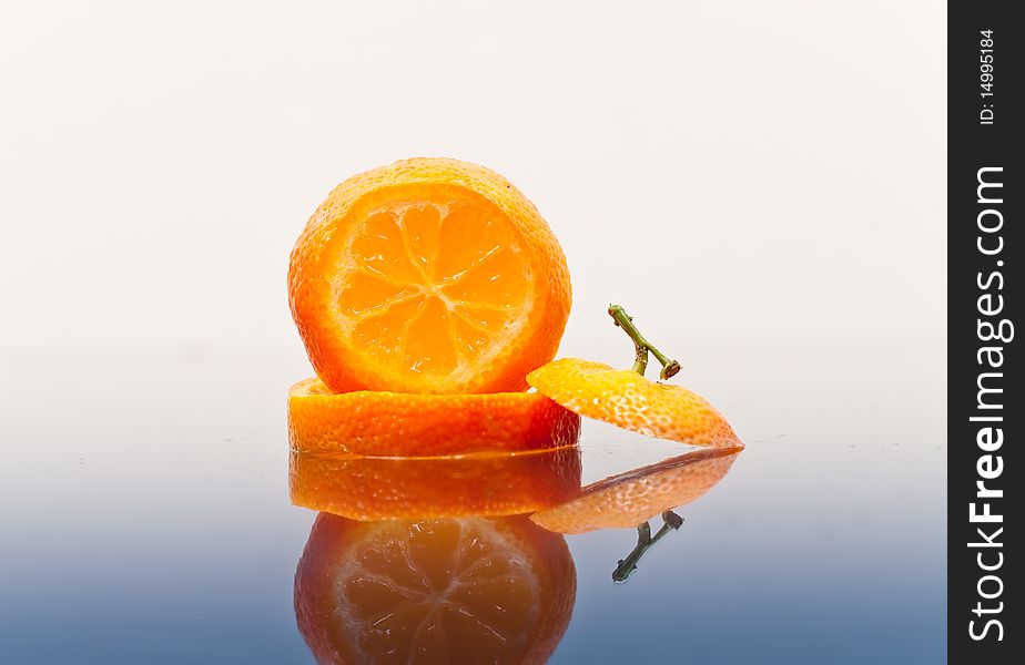 Orange slices stacked with reflection