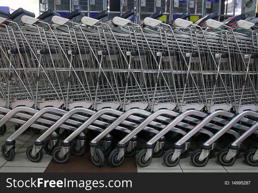 Shopping carts in front of a shopping center. Shopping carts in front of a shopping center