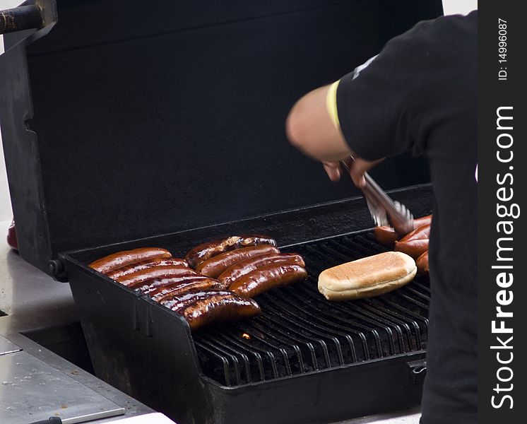 Shot of hot dogs in a grill