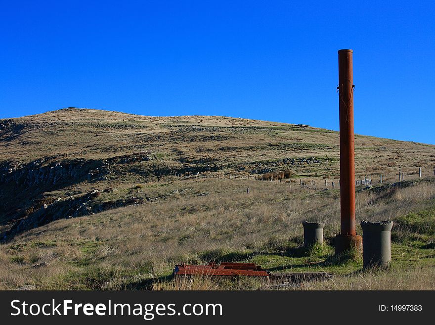 Ventilation pipes leading from underground bunker, with two pillbox/lookout posts on the hill beyond. Ventilation pipes leading from underground bunker, with two pillbox/lookout posts on the hill beyond.