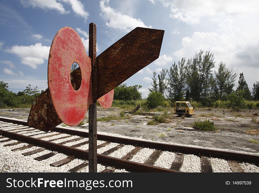 Railroad car by abandoned railroad tracks