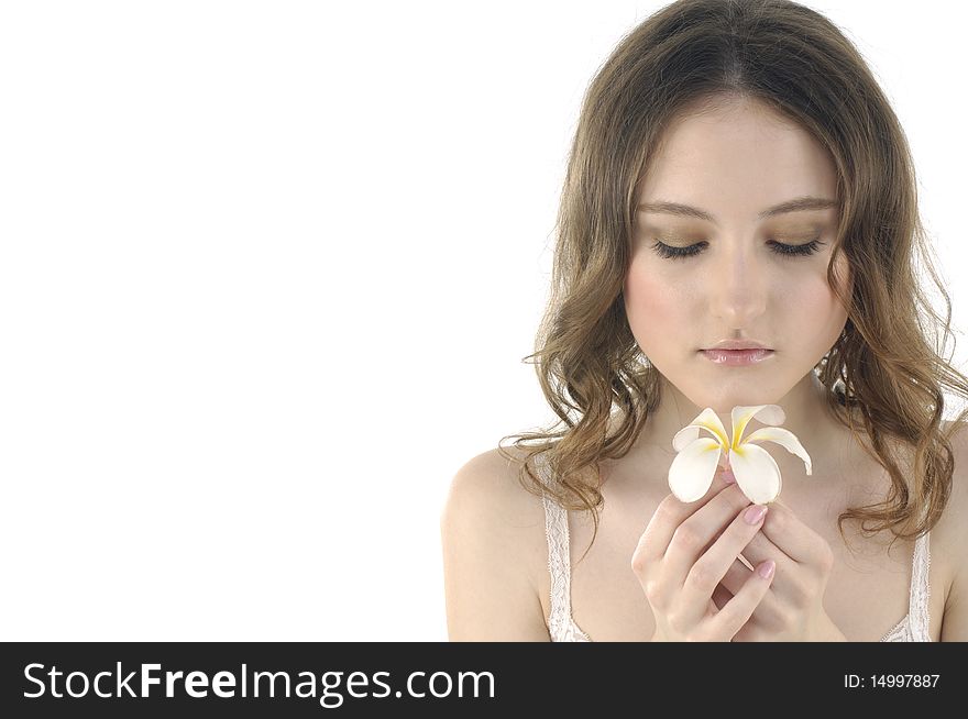 Young woman holding frangipani on white. Young woman holding frangipani on white