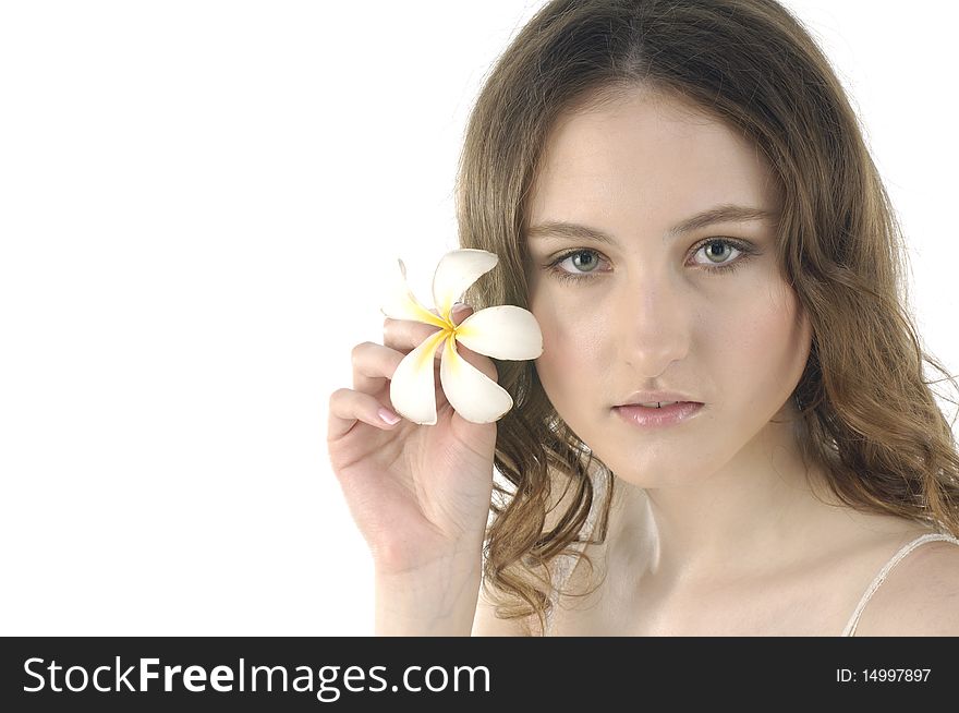 Young woman holding frangipani on white. Young woman holding frangipani on white