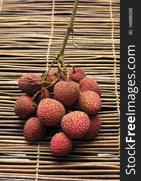 Lychee fruit on bamboo mat. Lychee fruit on bamboo mat