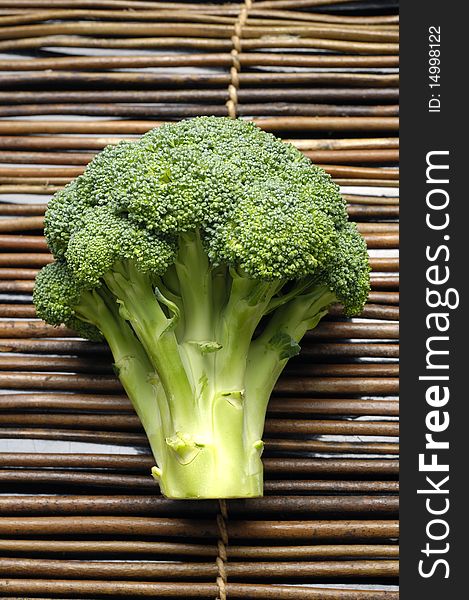 Fresh broccoli vegetable on bamboo mat