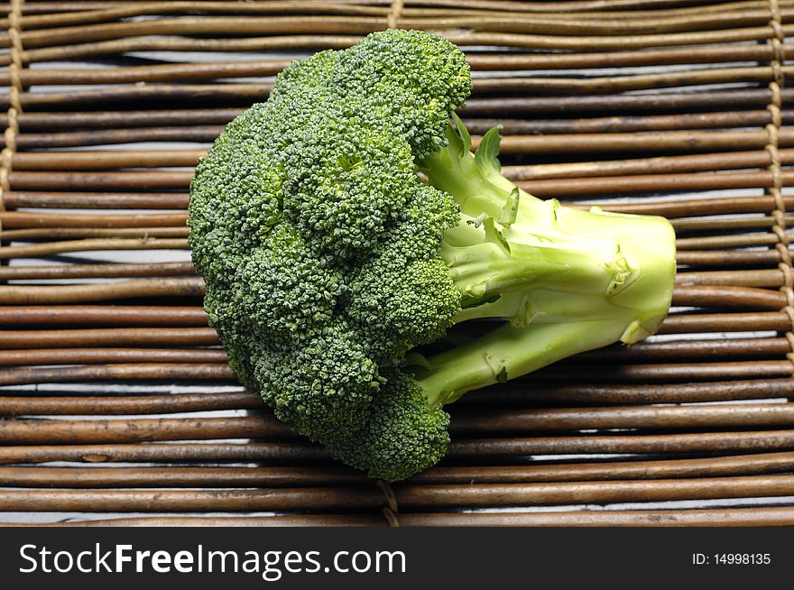Fresh broccoli vegetable on bamboo mat