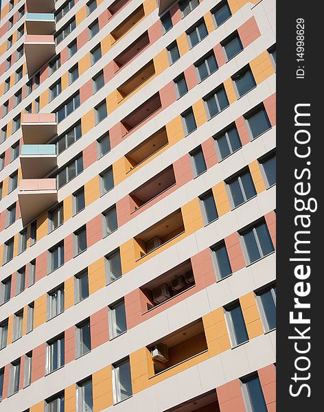 Fragment of modern residential building - windows and balconies in perspective