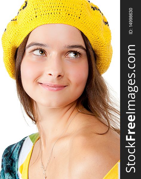 Portrait of a girl wearing yellow beret. Isolated over white background