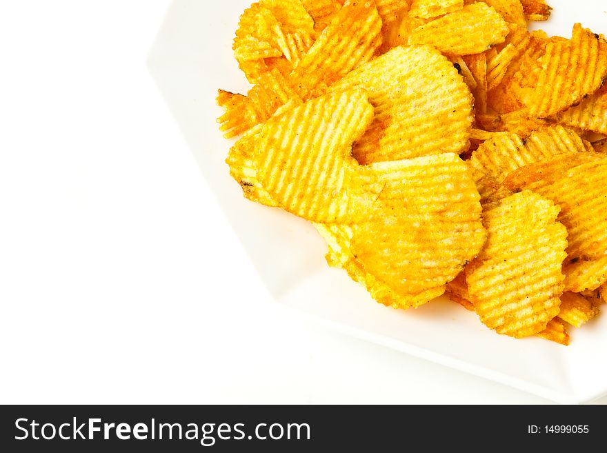 Delicious Potato chips against a white background