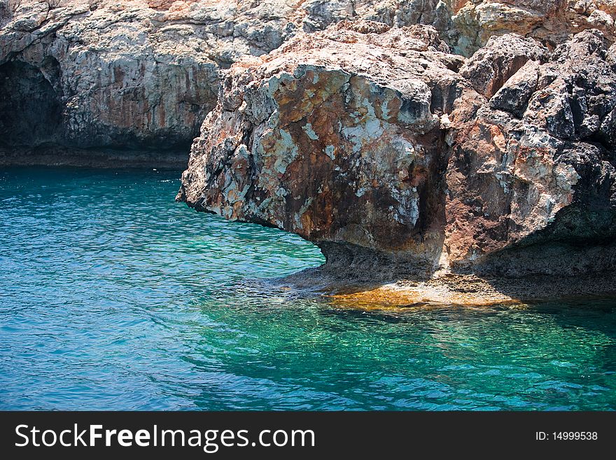 Turquoise water of the Mediterranean sea and coastal rocks