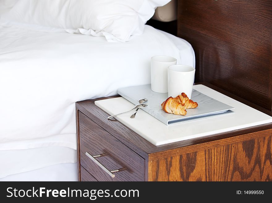 Tray with breakfast on a bed. Tray with breakfast on a bed