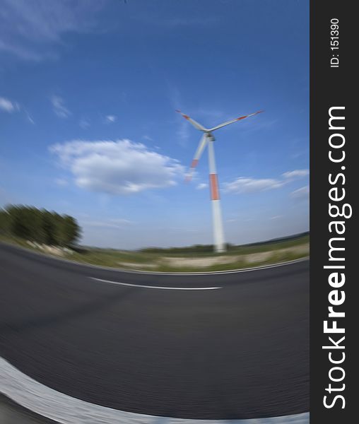 Blurred road with windmill