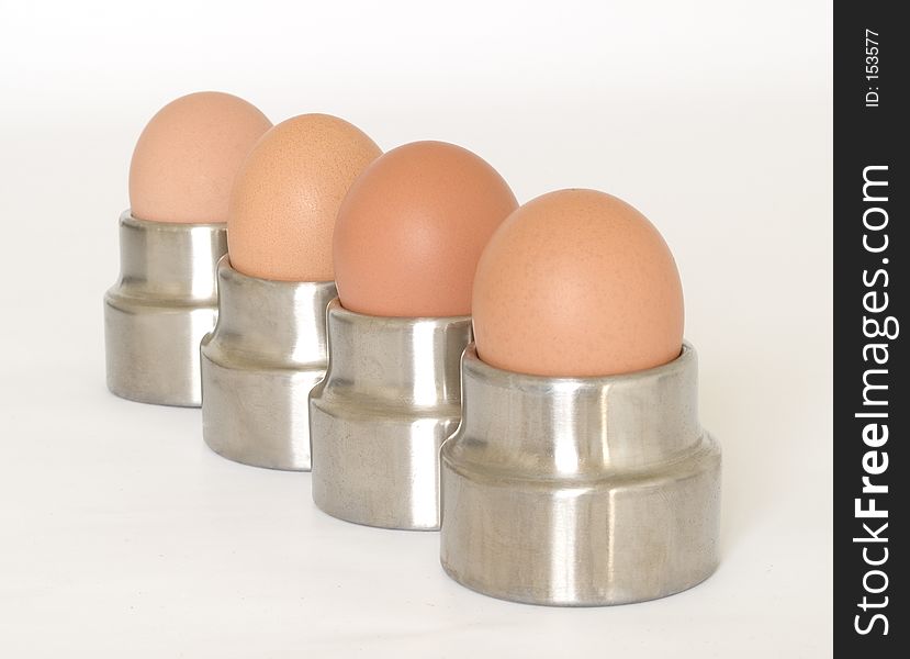 Four eggs in egg cups. Four eggs in egg cups