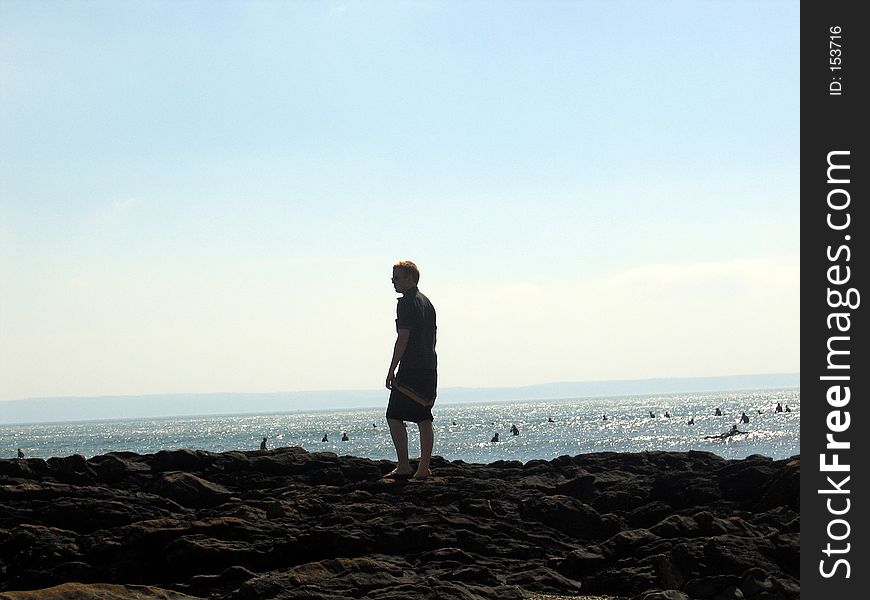 Watching the surfers at sunset in Devon