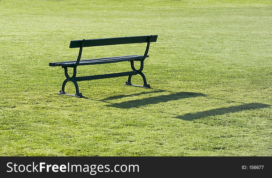 Wooden bench on green grass. Wooden bench on green grass