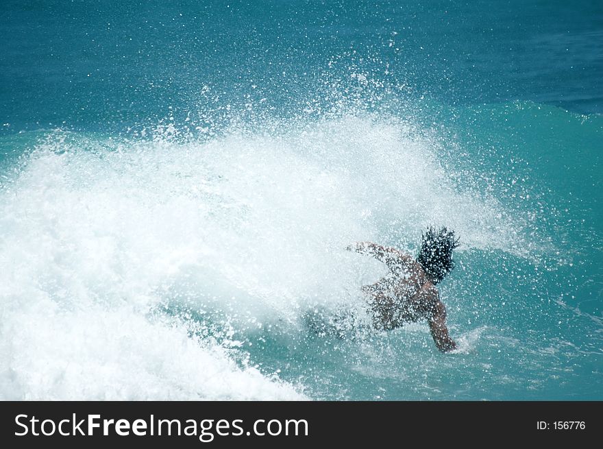 Surfer wipes out. Surfer wipes out