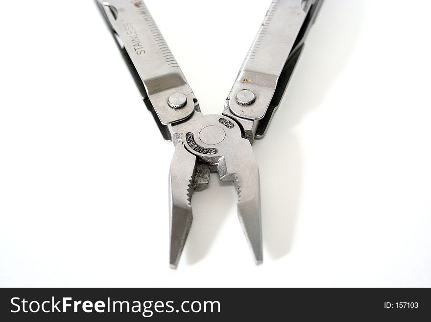 A pair of stainless steel silver pliers on a white background
