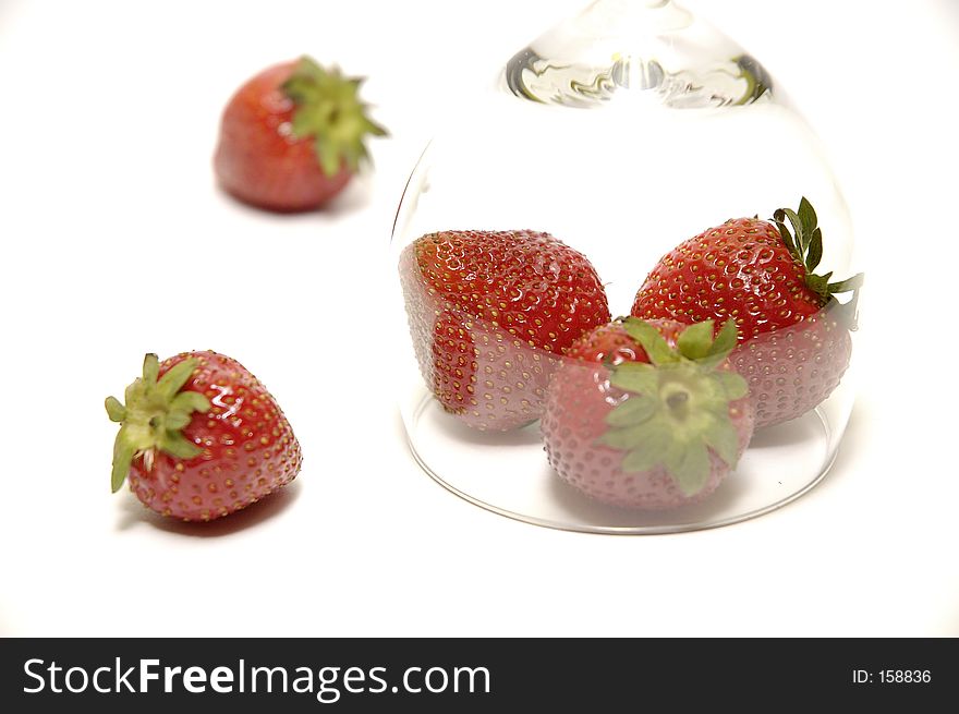 This is a composition of a strawberry below hooter. This is a composition of a strawberry below hooter