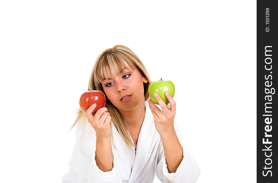 Young girl with two apples. Focused on apples.